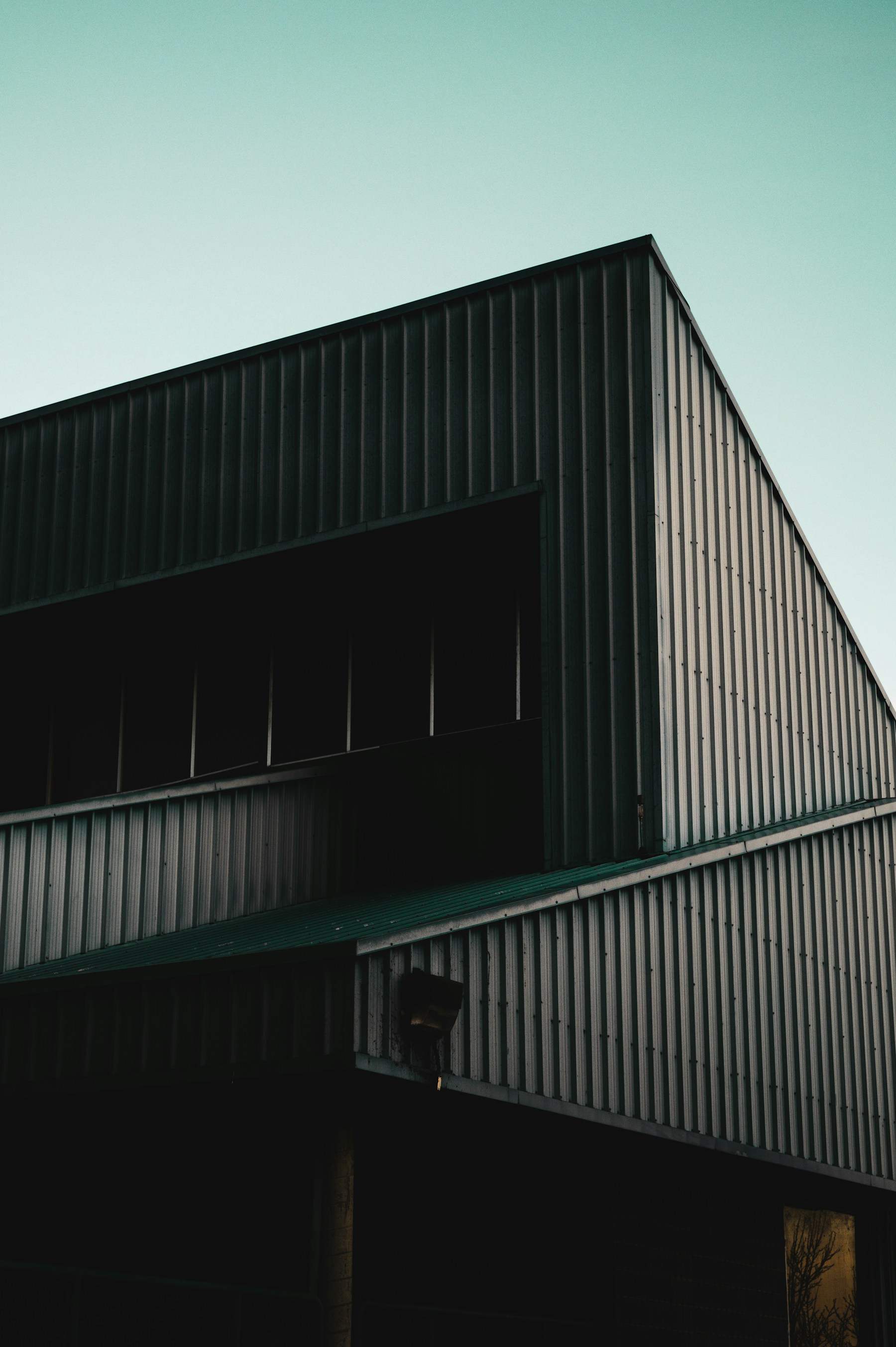Concrete architecture, with repeating geometric lines and deep shadows